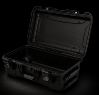 A black hard-shell protective carrying case shown open on a dark studio background, with the lid propped up and latches secured.
