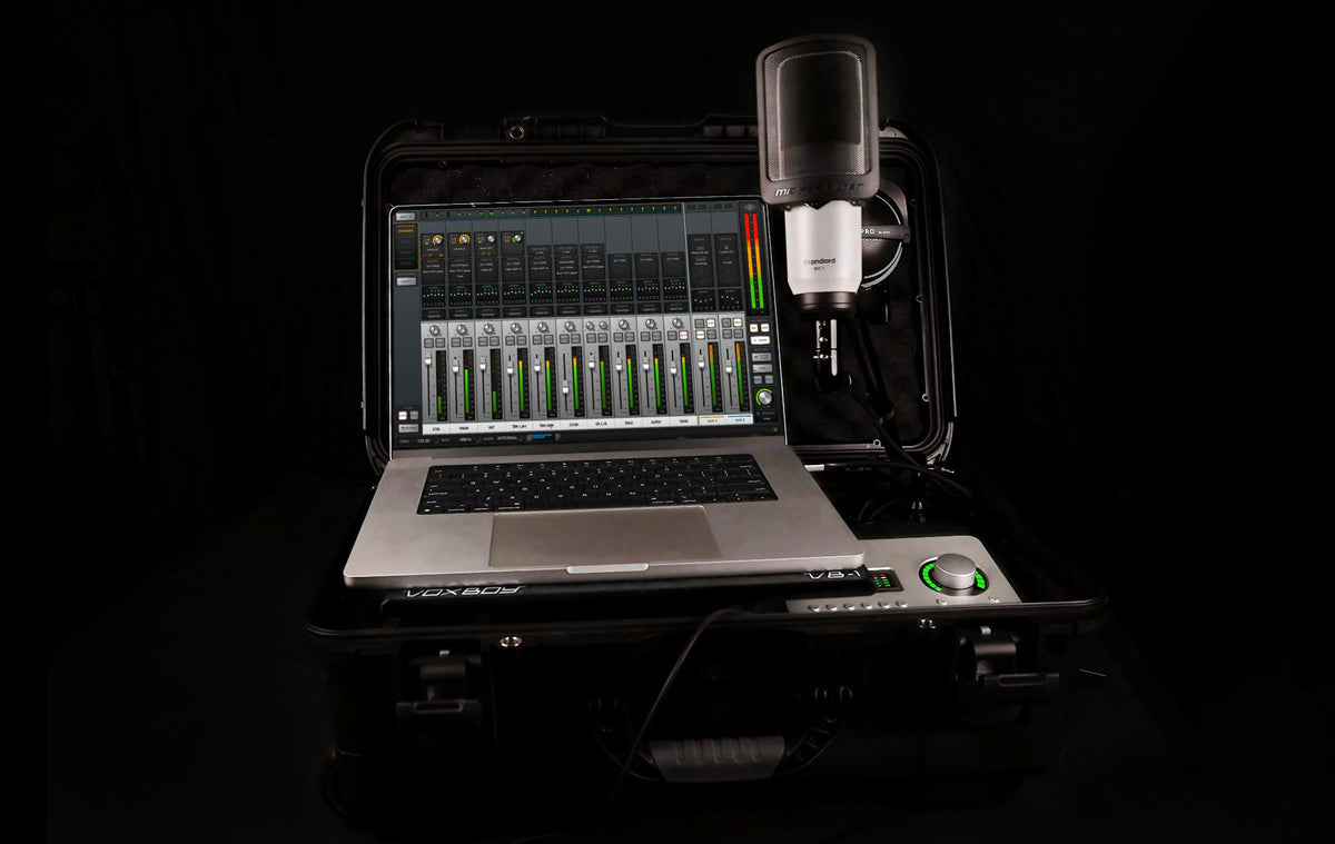 Voxboy portable audio recording sutdio. Shows a mil-spec case, Laptop with audio software, microphone, and headphones on a black background