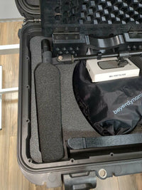 Close-up of the Shotgun Ready foam channel sized for a Sennheiser MKH 416, with the pop filter box and boom arm stowed in the lid
